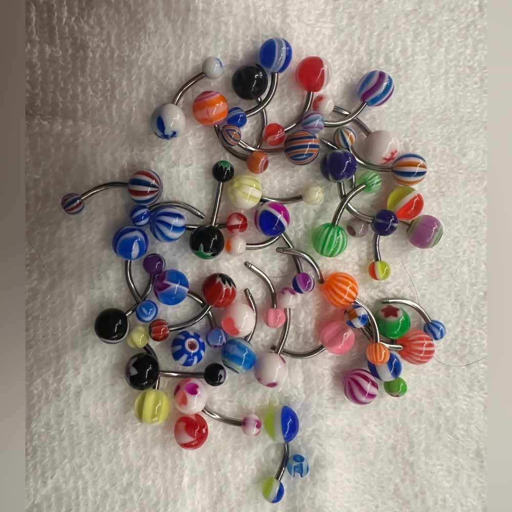 Very colorful belly piercings!